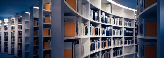Assorted books in a library's shelves