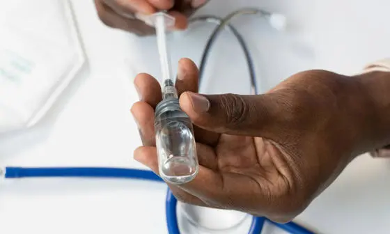 A person holding a stethoscope.