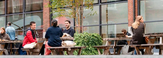 Students sitting outside the LSE Library.