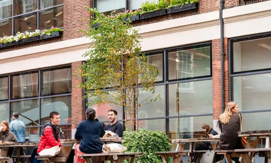 Students sitting outside the LSE Library