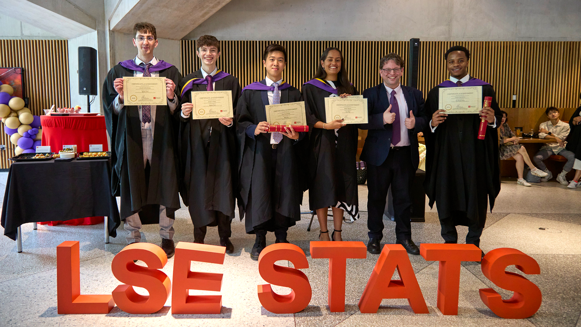 LSE Department of Statistics prize winners with certificates in the Marshal Building