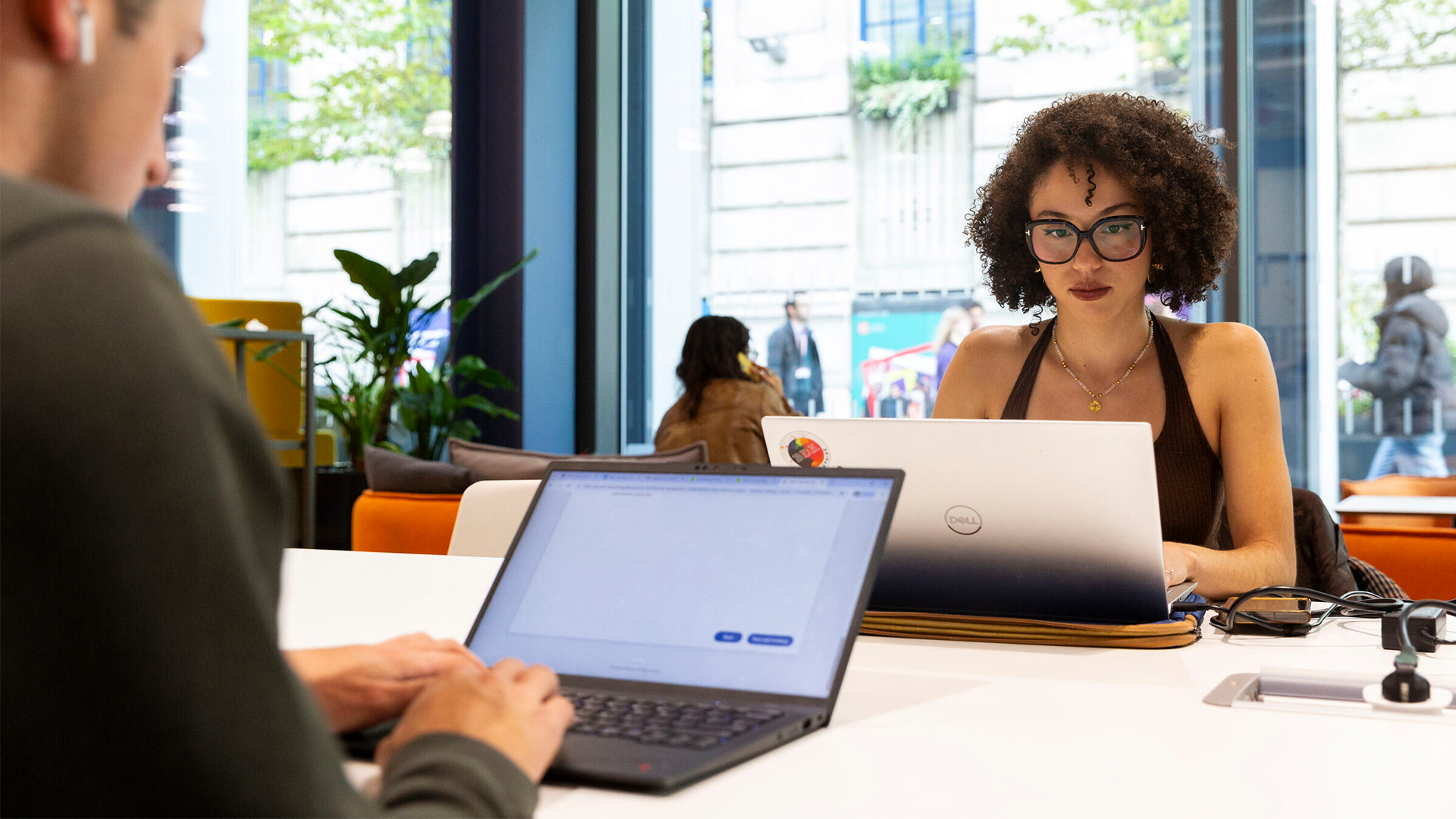 Two students working on laptops