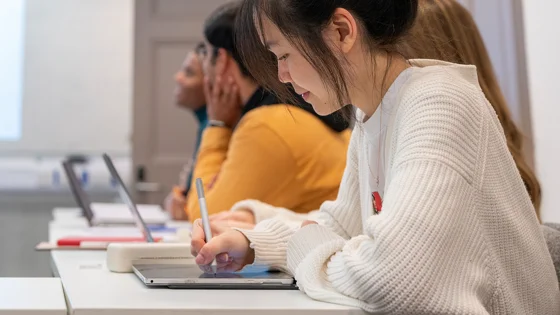 Students in class making notes
