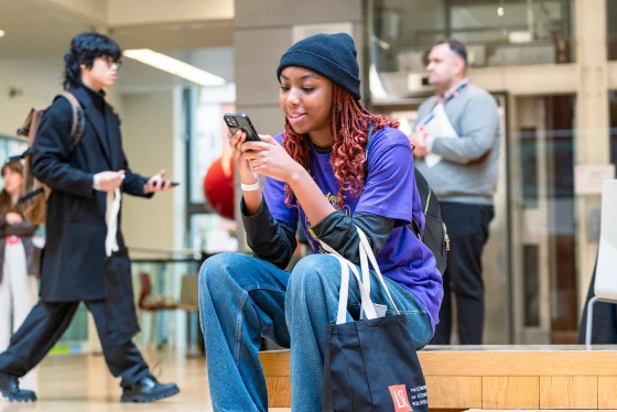 A student looking at their phone