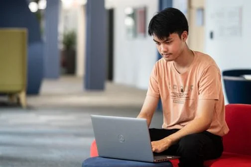 Student working independently on a laptop