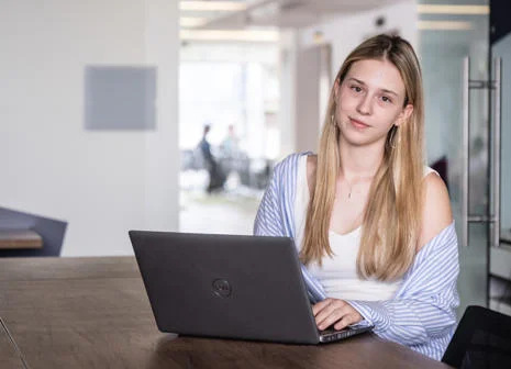 Student using a laptop at a desk