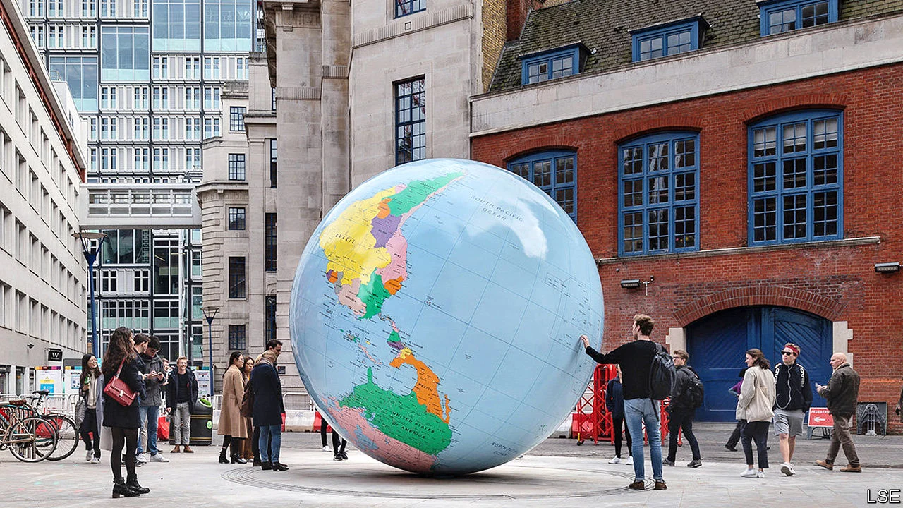 People looking at the LSE globe installation on the LSE campus