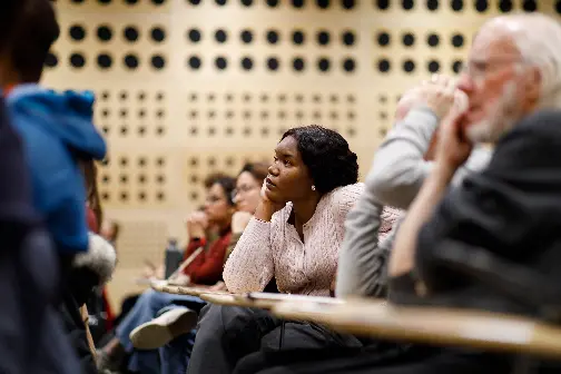 An LSE event in the Auditorium with audience members listening attentively.