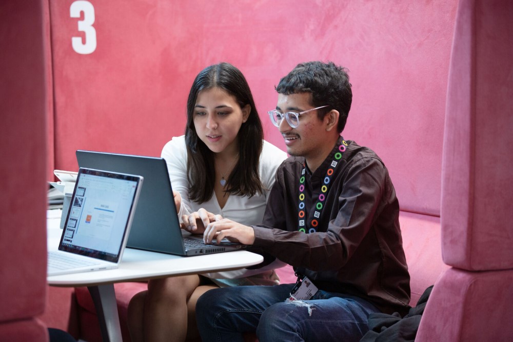 Students looking at a laptop