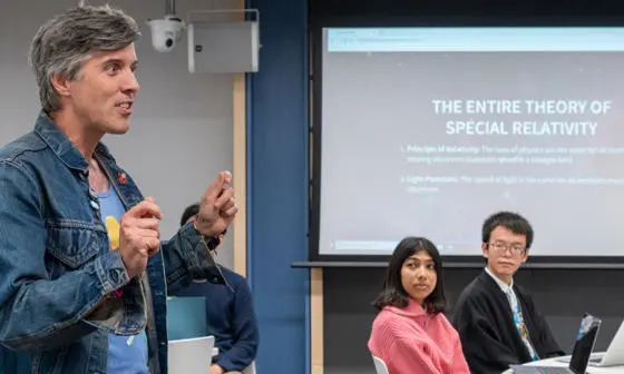 Professor Bryan W. Roberts delivering a lecture