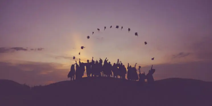 Students throwing their graduation caps