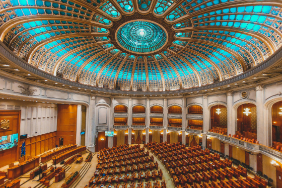 A hall with multiple seats suited to host delegates/policymakers.