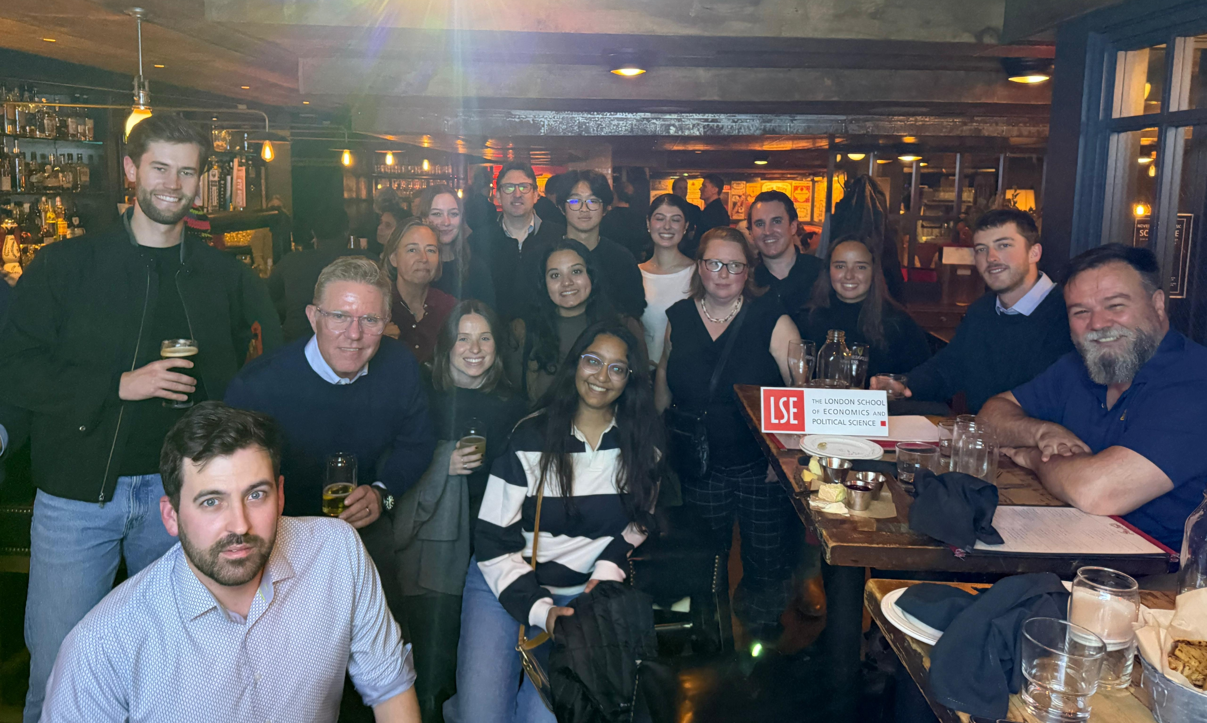 Alumni gather in a pub for Welcome to the City in Boston, USA.