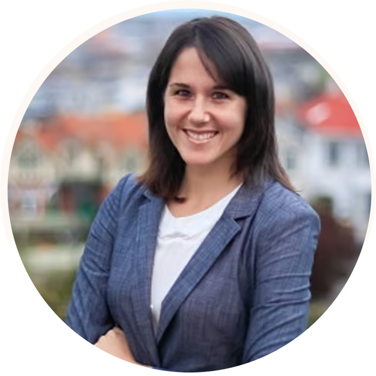 Smiling headshot image of Maja Grasso with folded arms.