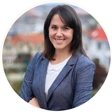 Smiling headshot image of Maja Grasso with folded arms.