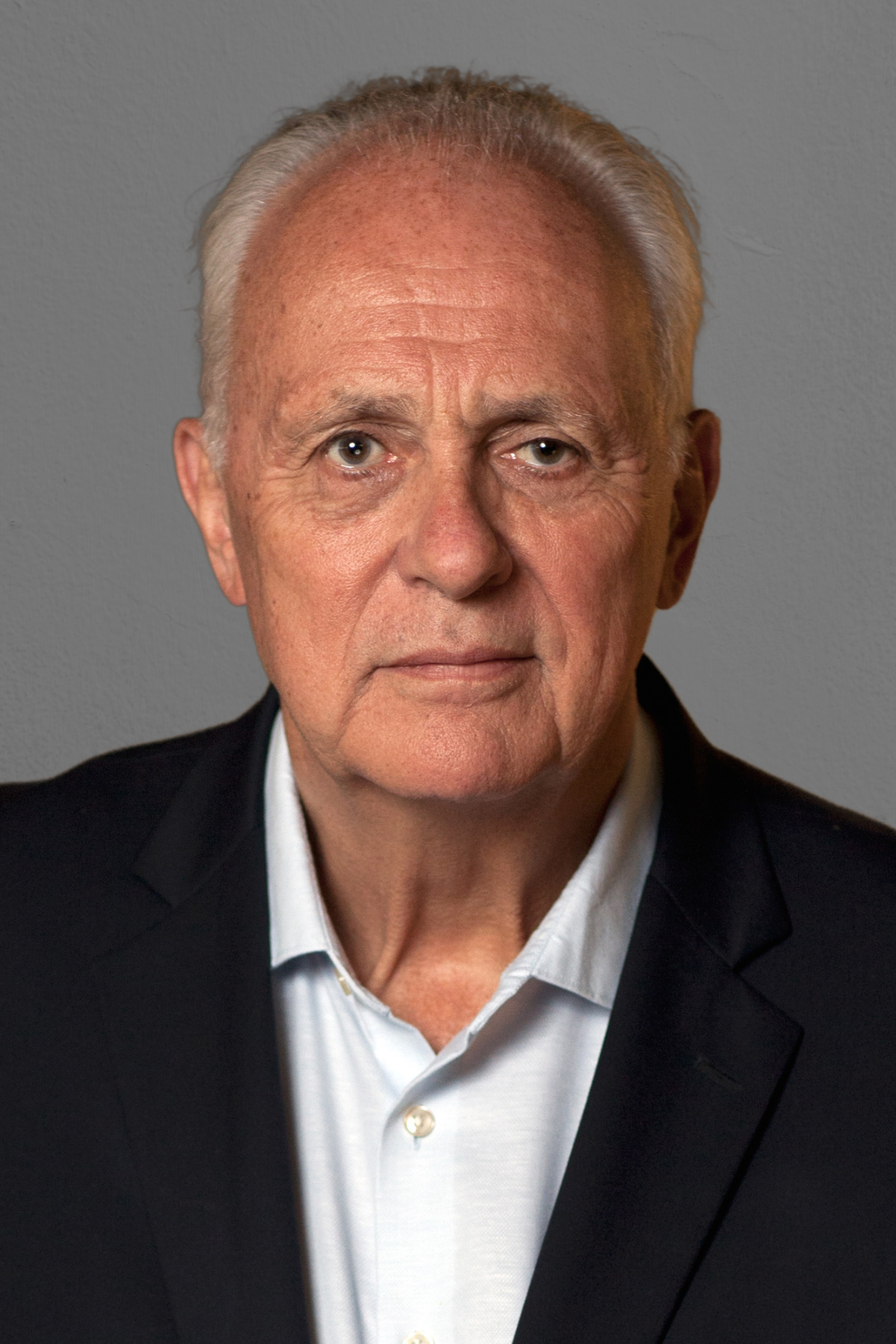 Headshot of Mark Malloch Brown in a suit
