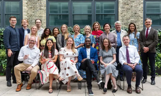 Group photo of Marshall Institute and 100x Impact staff at 2025 summer party.
