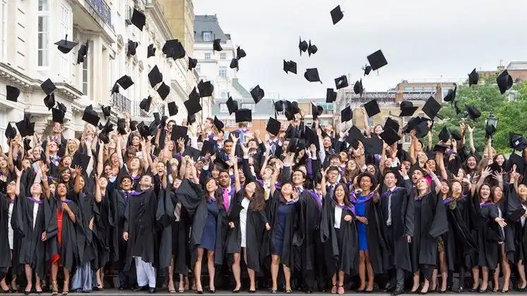 LSE graduates tossing their caps in the air.