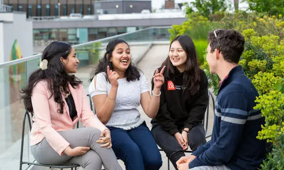 Students chatting on an LSE rooftop.