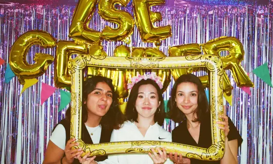 Students smiling at a celebration