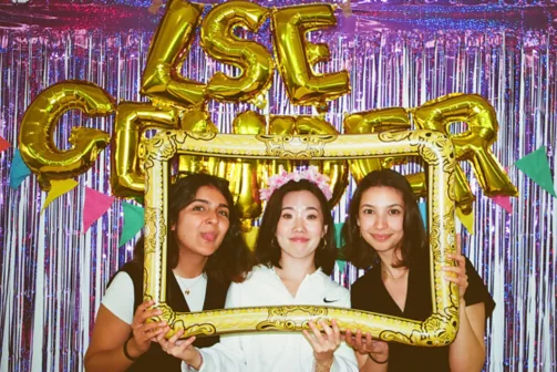 Students smiling at a celebration