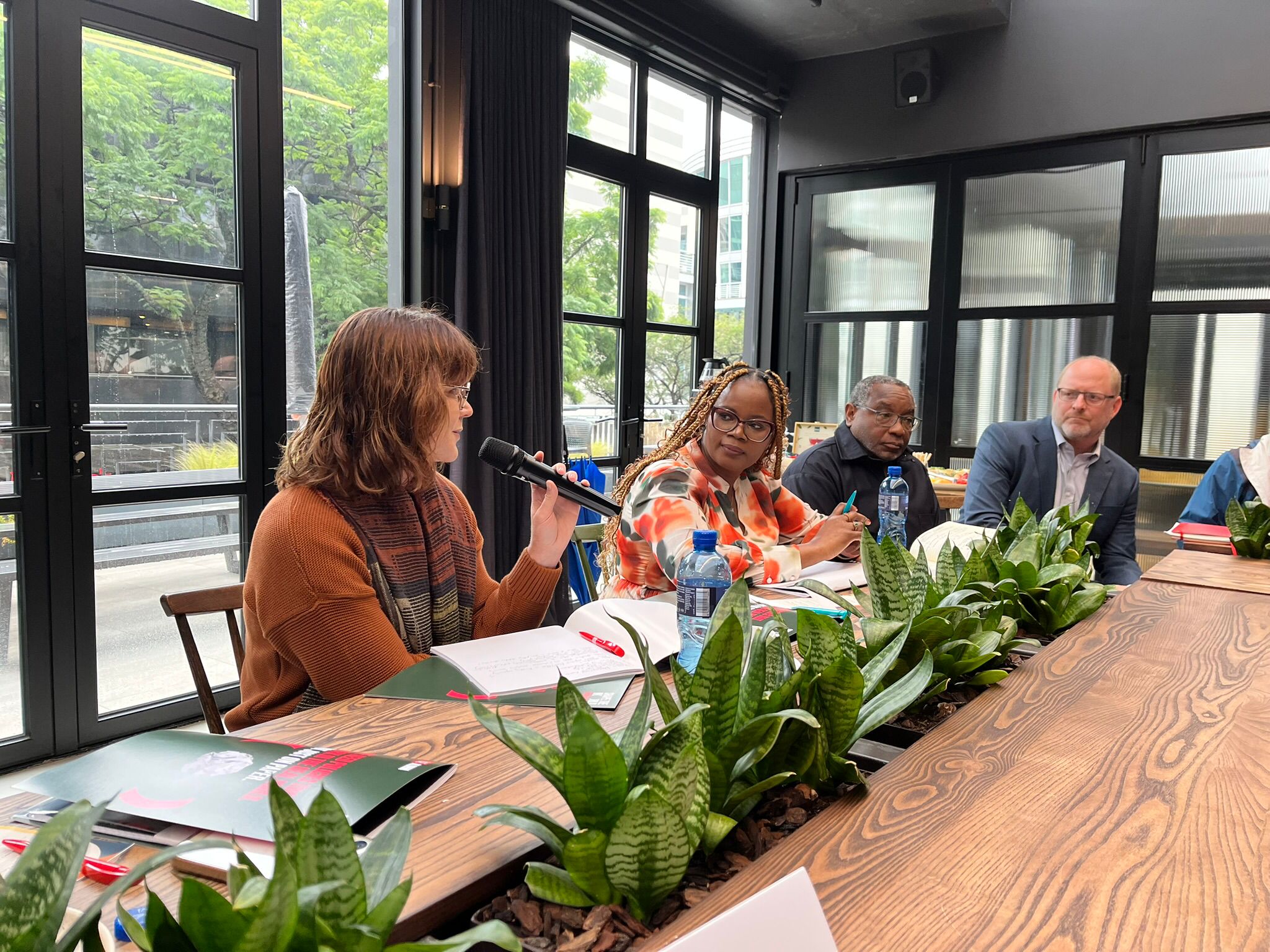 An alumnae speaks during a round-table event in Nairobi