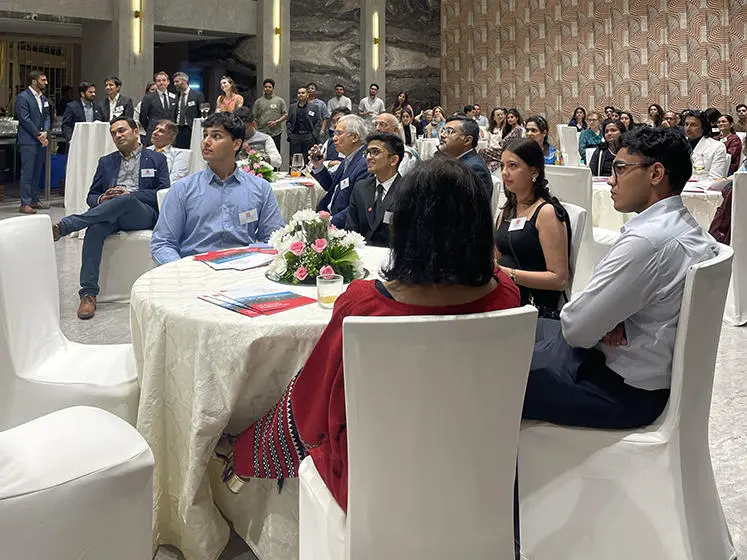 Guests enjoying the alumni reception in Mumbai