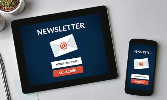 iPad and phone with a newsletter sign-up open