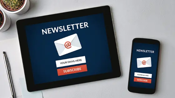 iPad and phone with a newsletter sign-up open