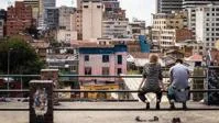Two people looking at a developing city skyline