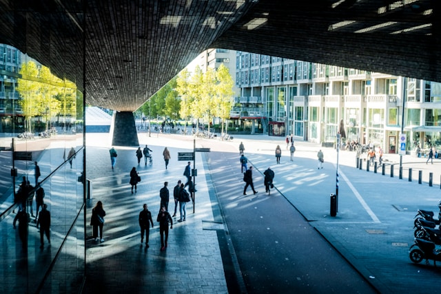City street with bridge and pedestrians
