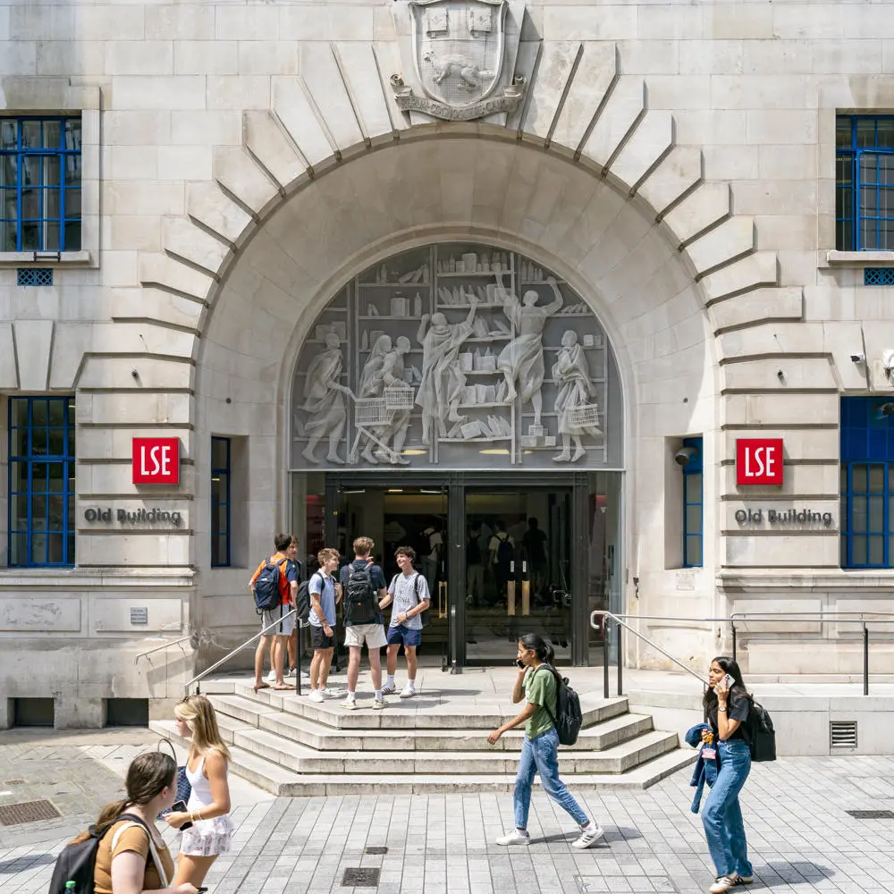 People walking past LSE old building