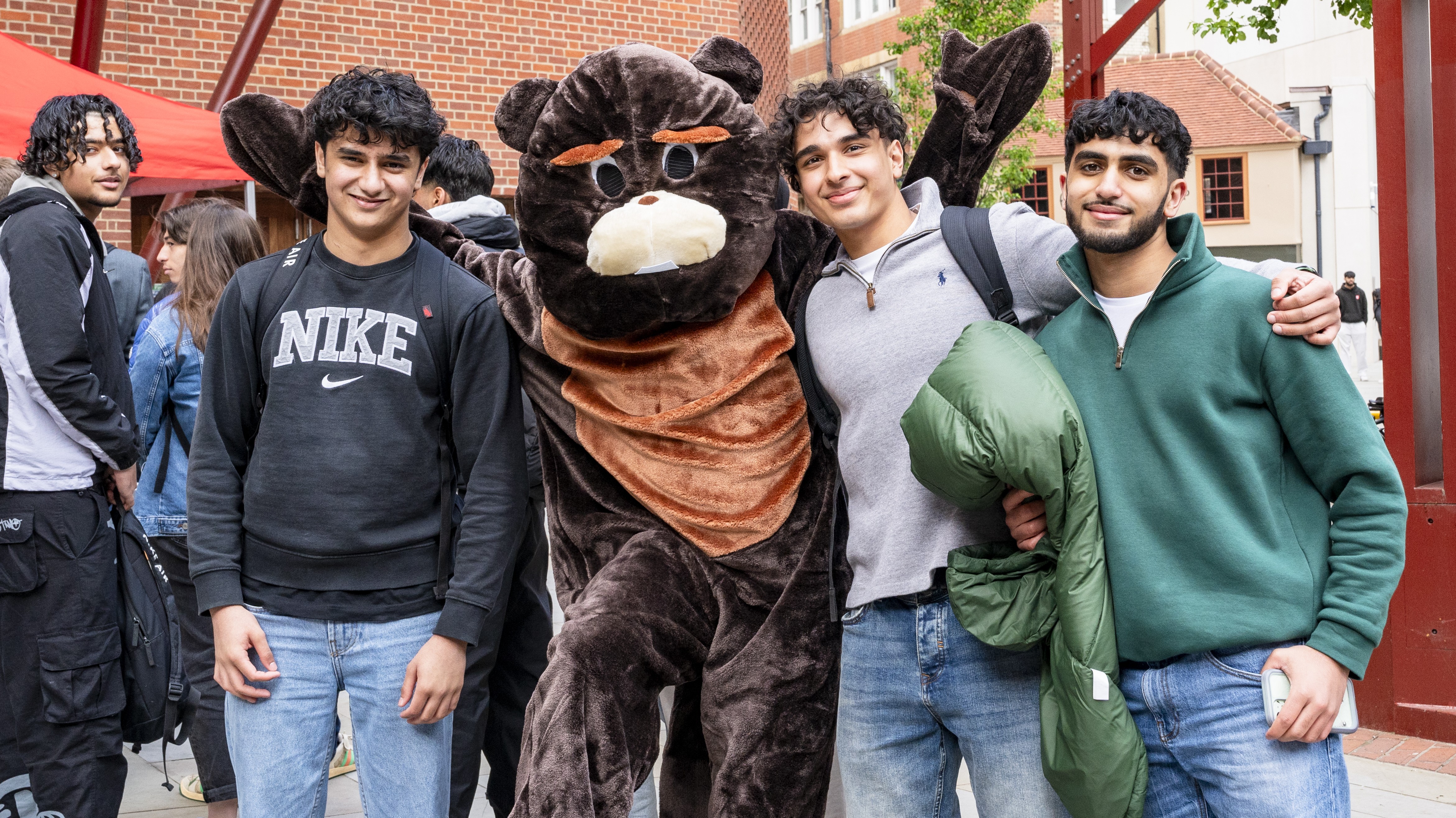 Open Day visitors pose with mascot