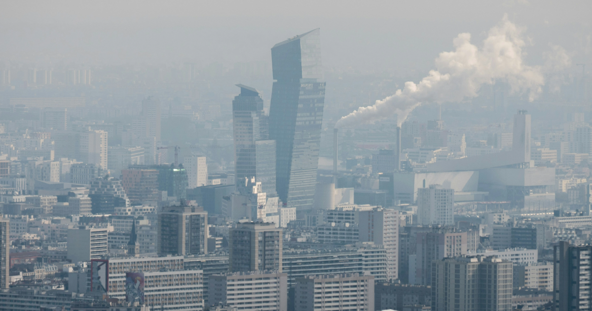 smokey, pollution-ridden city with high-rise buildings