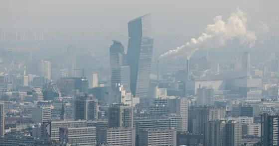 smokey, pollution-ridden city with high-rise buildings