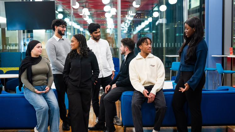 Group photo of seven New Future Fund Scholars chatting with each other