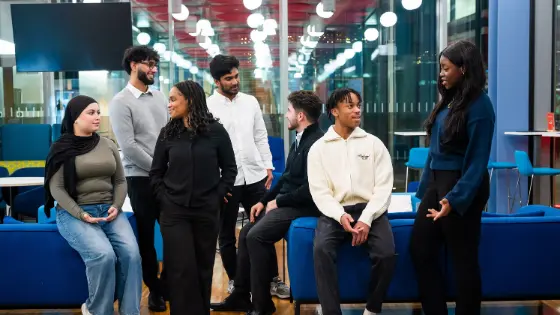 Group photo of seven New Future Fund Scholars chatting with each other