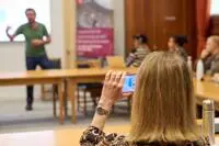 Participant taking photo at PBS and GSOS event