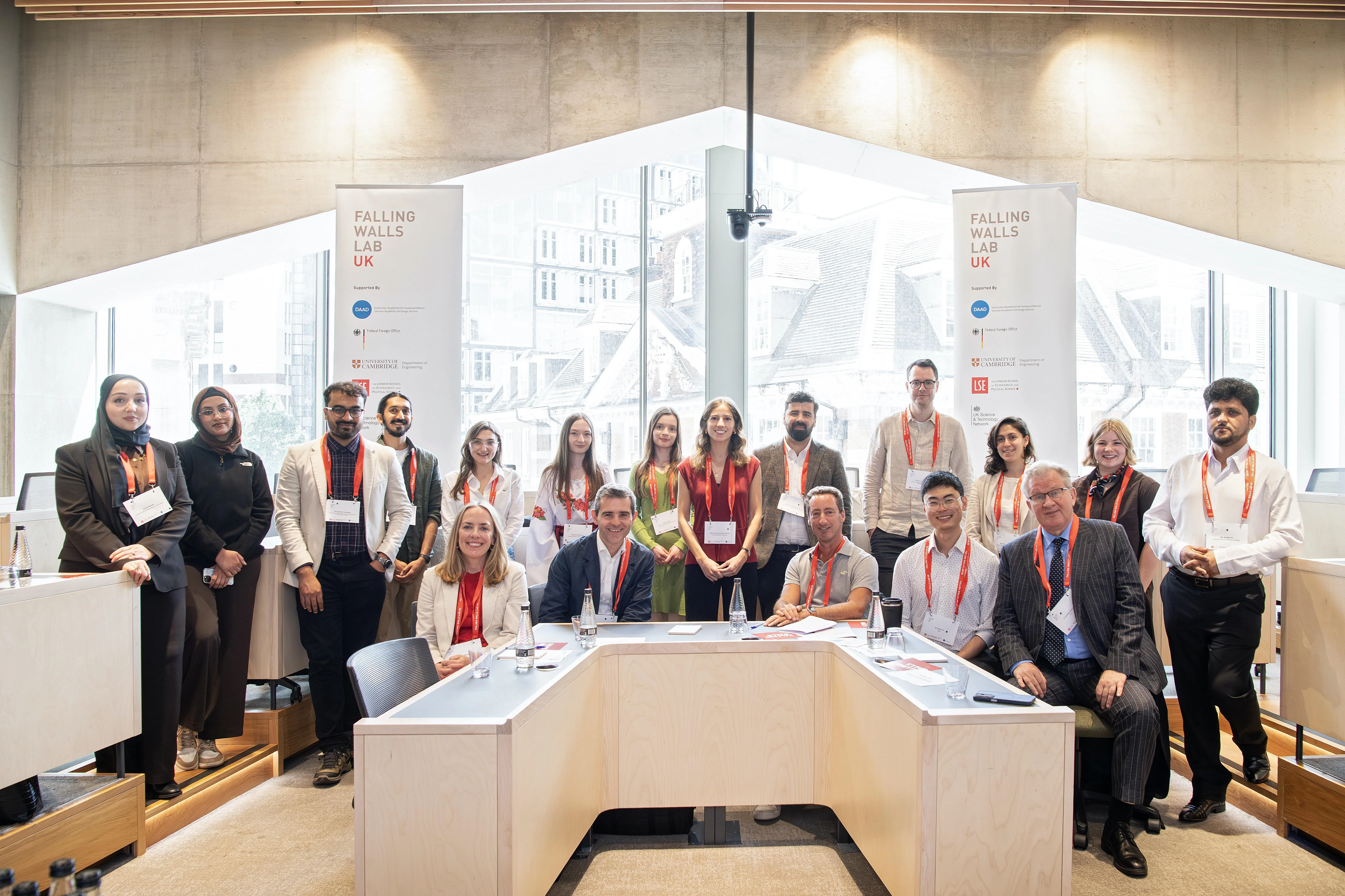 The Falling Walls Lab UK participants posing with the panel of judges at the end of the competition.