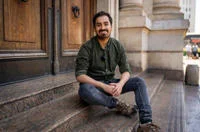 Pedro Fierro sat on steps