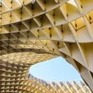 Geometric wooden lattice structure forming a curved canopy