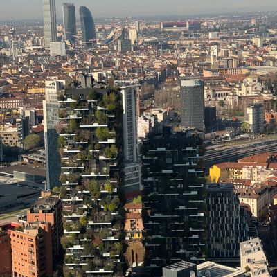 Aerial view of Milan showcasing the iconic Bosco Verticale with cityscape backdrop.