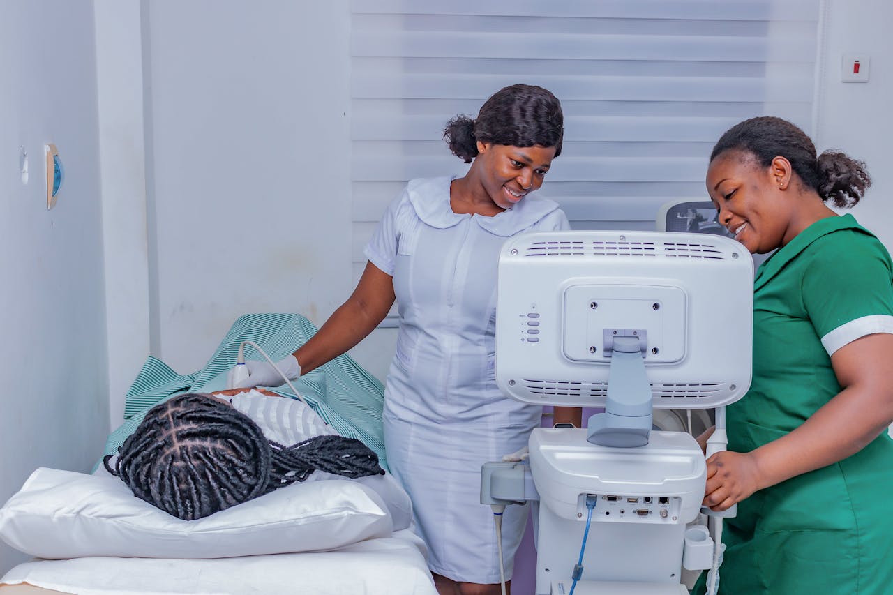 Healthcare staff operating an ultrasound on a patient