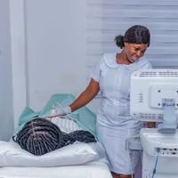 Healthcare staff operating an ultrasound on a patient