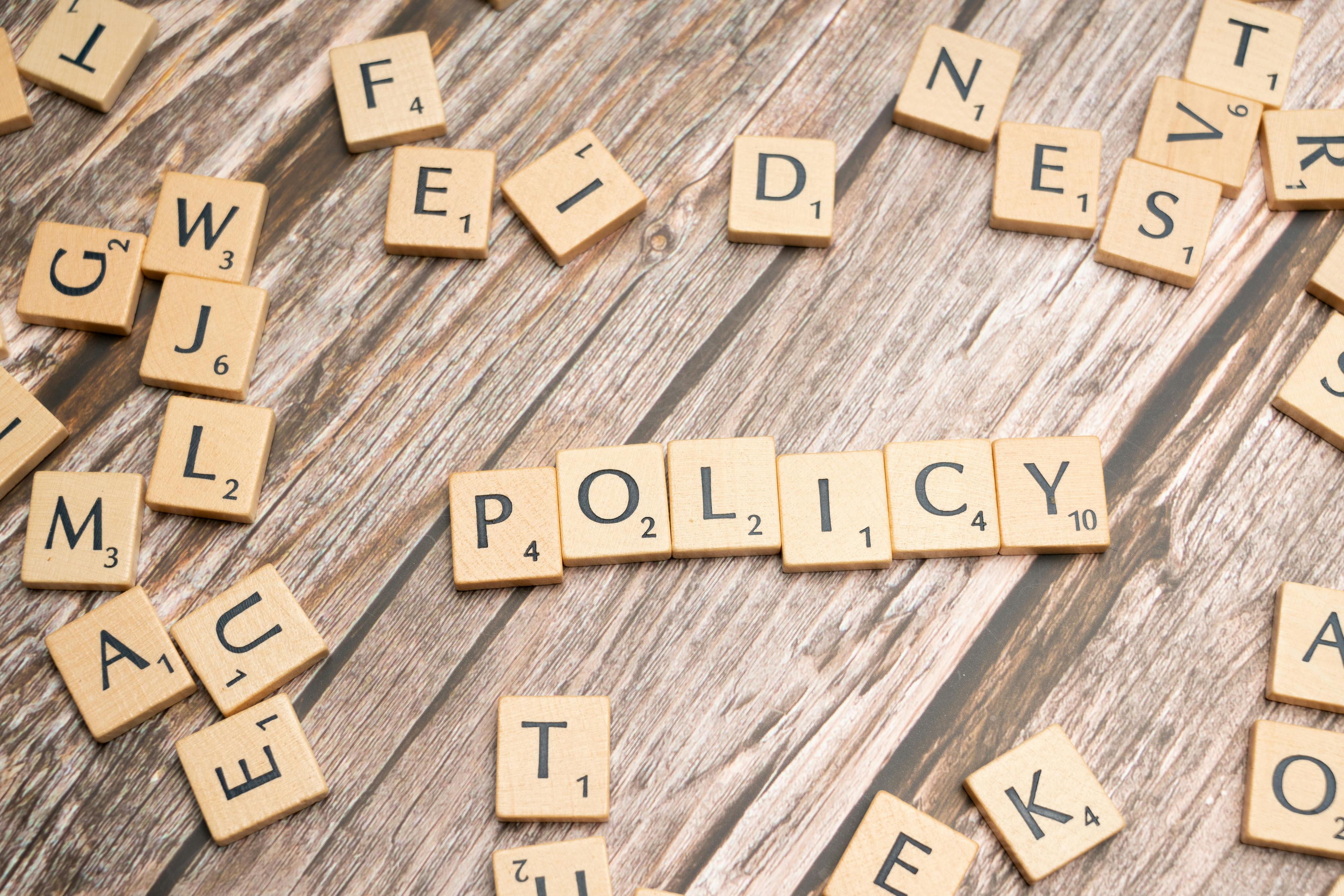 Scrabble letters, spelling out 'policy'