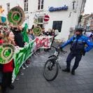 Climate activists hold signs during a street protest calling for urgent environmental action.
