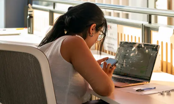 Student working on their laptop