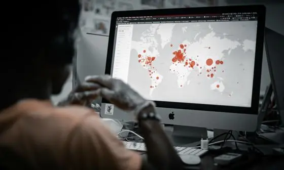 Someone looking at a disease map on a PC