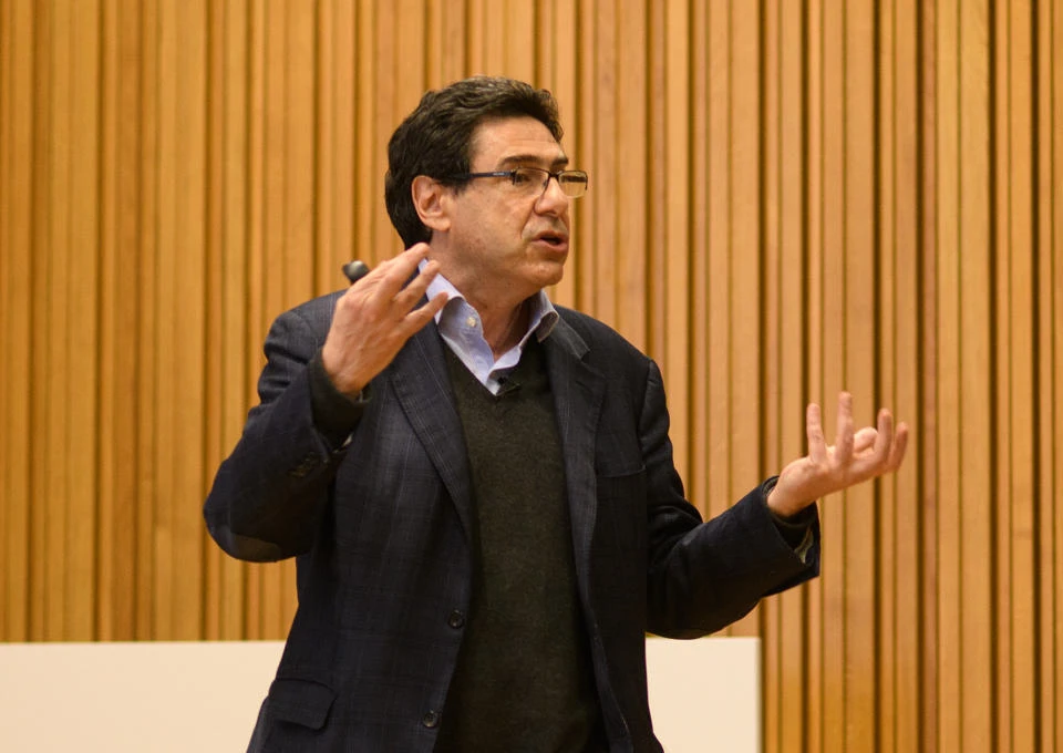 Professor Philippe Aghion teaching in a classroom