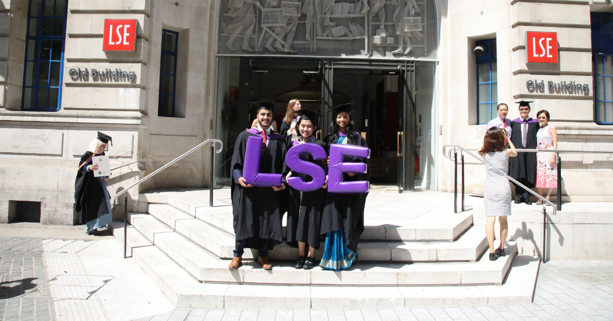 Graduates holding an LSE sign